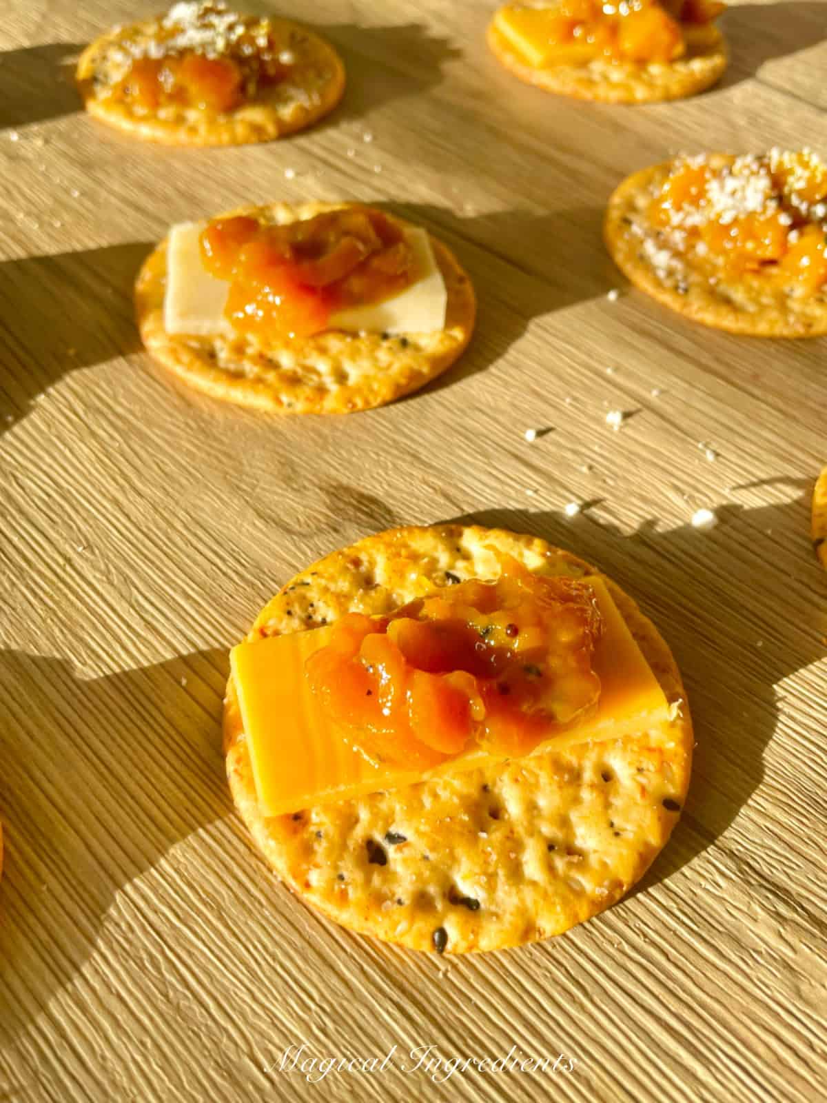 appetizer bites topped with cheese and mango habanero chutney