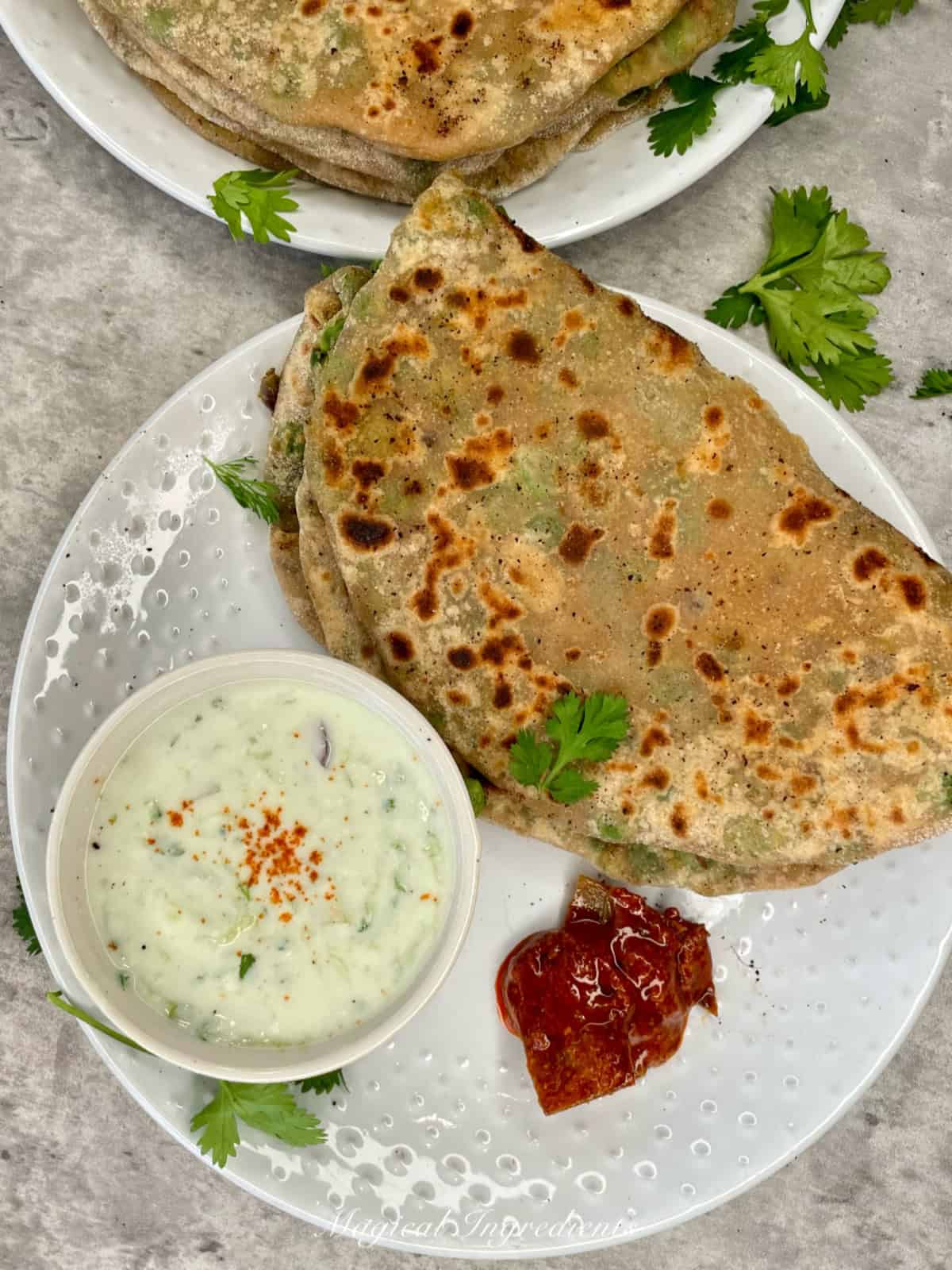 parathas served with raita and pickle