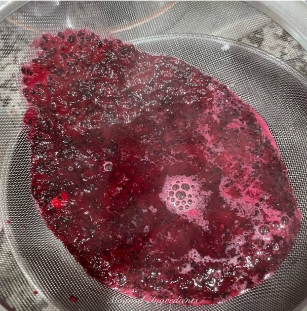 straining the dragonfruit mixture