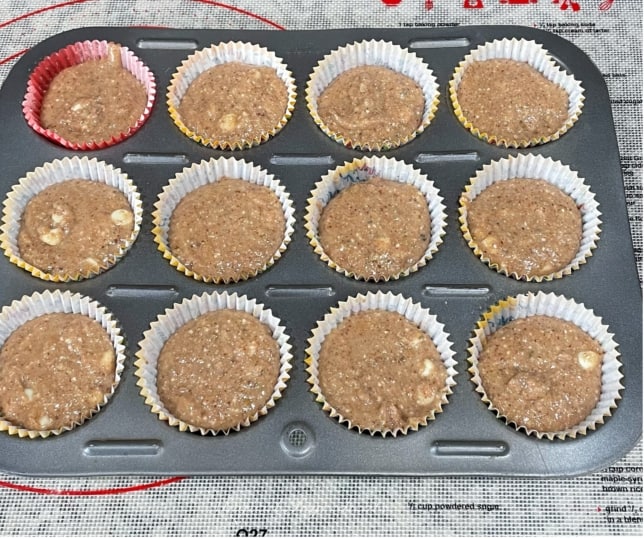 Transfering muffin batter to lined baking tray