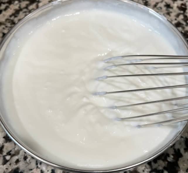 whisking the yogurt