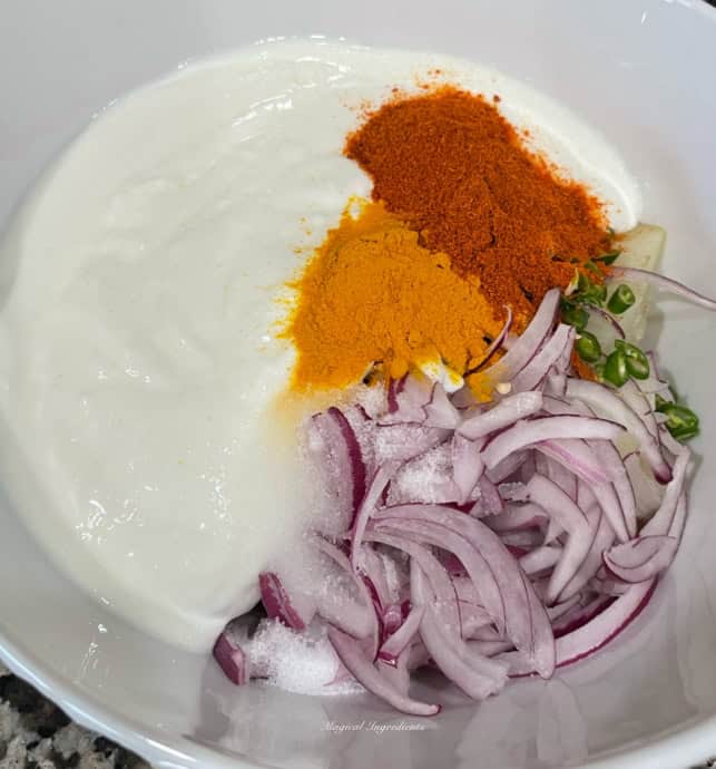 adding all the ingredients for the potato salad