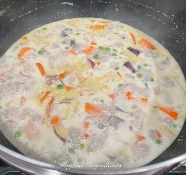 simmering with coconut milk and water